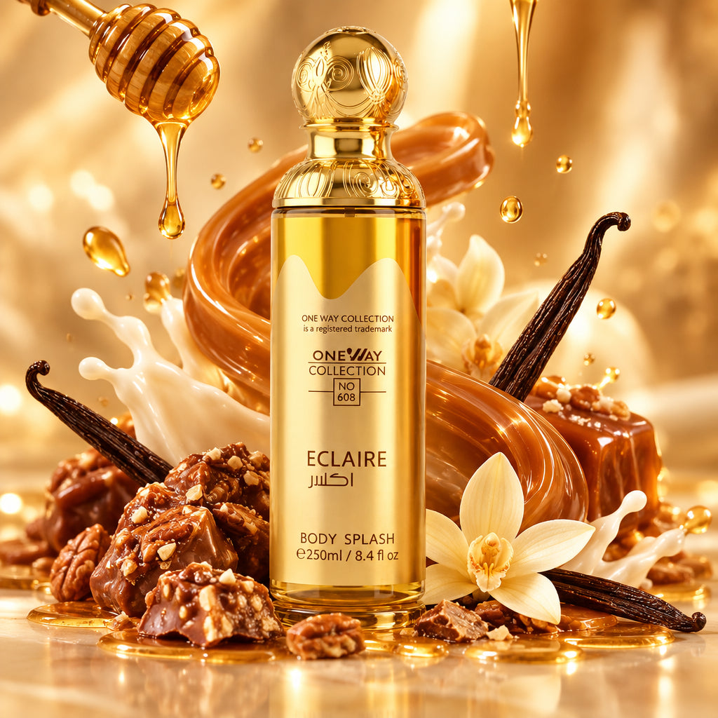 A bottle of One Way Collection Eclairre Body Splash with a metallic gold cap and golden liquid inside, set against a light marble background.