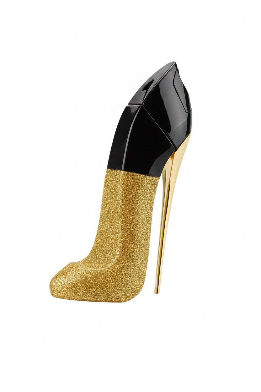 A hand holds a gold glitter high-heeled shoe with a glossy black toe cap in a boutique setting, with other black and gold heels displayed on a stand in the background.