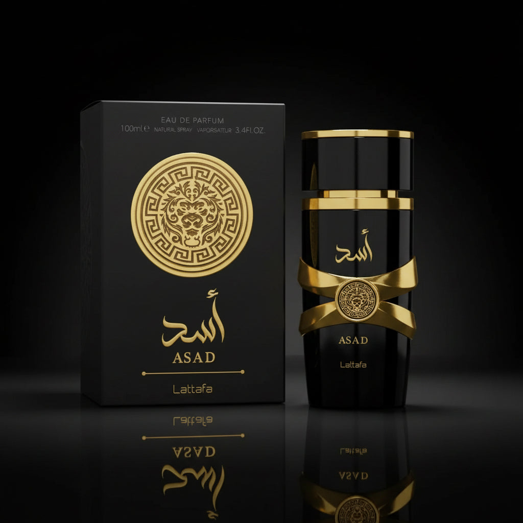 Black and gold ASAD Lattafa Eau de Parfum bottle next to its black packaging box, both featuring gold Arabic calligraphy and a circular Greek key lion emblem.